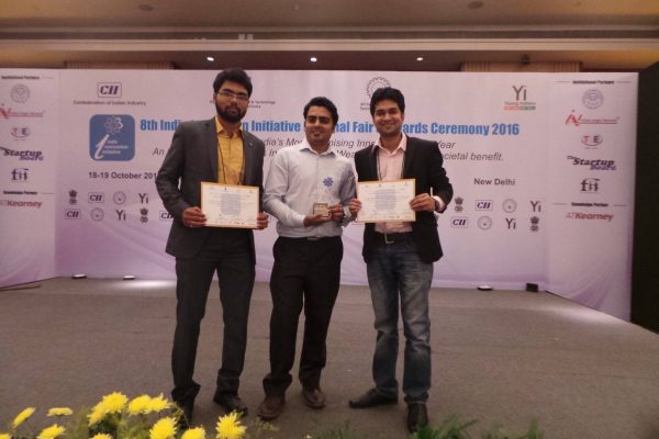 from Left to Right, Shaswat, Vaibhav, Gaurav with Posing for Photograph on the stage with Certificates and Award in hand